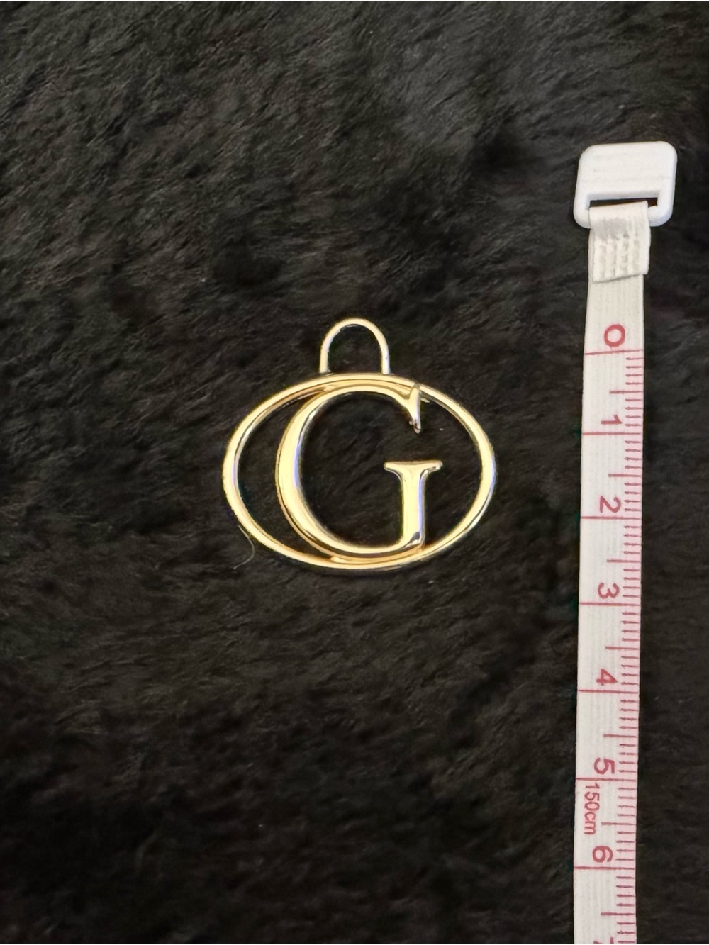 Gold toned G logo  Guess Pendant